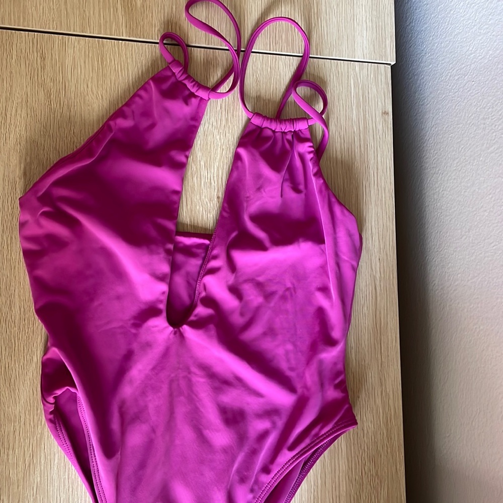 Women’s size small pac fun fuscia one piece. Cheeky back. Worn once, hand washed